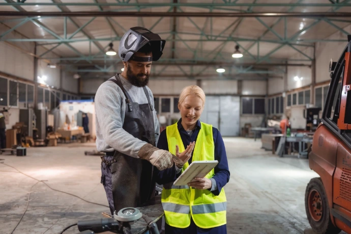 Welder and inspector going through WPS